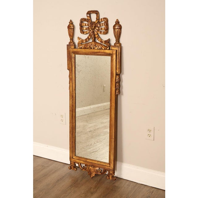 High Quality Italian Made Wall Mirror Featuring A Carved Gilt Wood Frame With An Ornate Bow Form Crest, Turned Finials,...