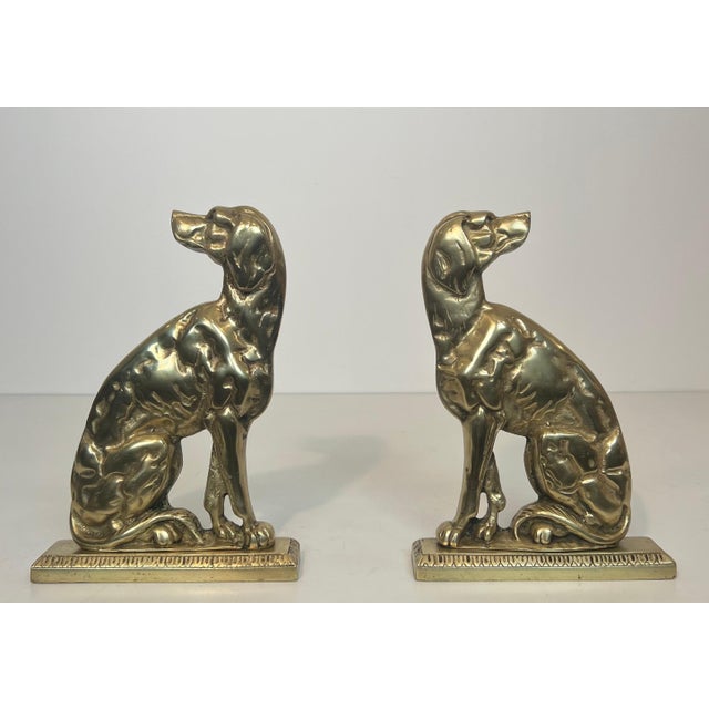 This pair of bronze andirons depicting dogs is a French work from the Art Deco period. Circa 1930