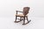 Mid-Century rocking chair produced in Sweden, 1950s. Stained solid pine structure with a loose seat cushion pad. Condition...