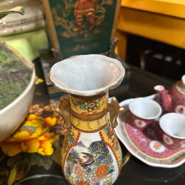 Up for consideration is a beautiful vintage Asian style small ceramic vase with gold accents. This would look lovely in...