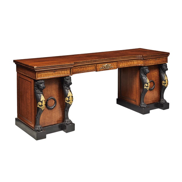 Exquisitely hand-crafted in 1815, this Regency era sideboard is mahogany with ebony inlays, parcel gilt features, and...