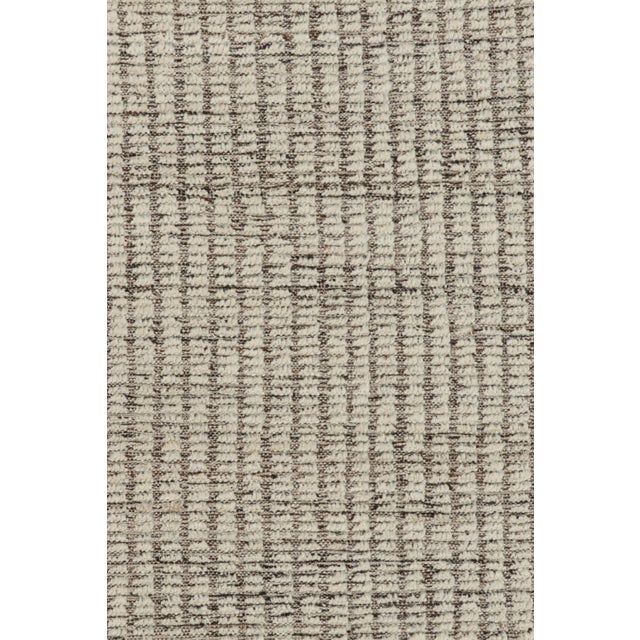 Handwoven in wool, this 10x13 contemporary Kilim is an exciting addition to both the Kilim & Flat Weave and Textural rug...