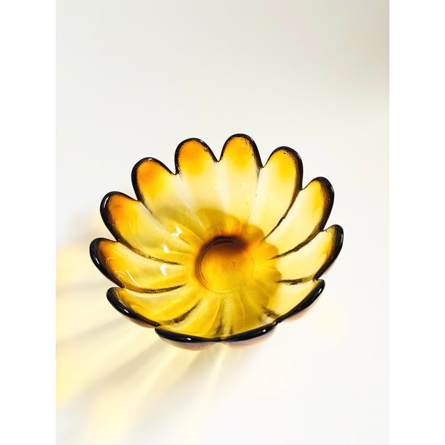 A large mid century glass lotus shaped bowl by Indiana Glass. Beautiful color to the glass which fades from brown at the...