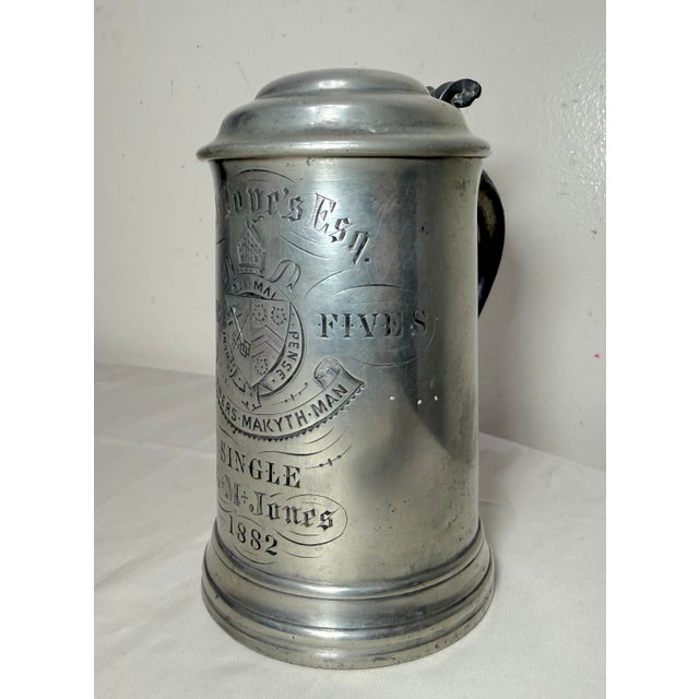 Up for sale is a rare antique hand engraved pewter college football tankard trophy. This lovely lidded stein style trophy...