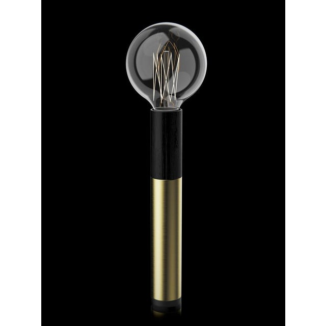 Table lamp with brushed brass, black wood and black paint structure. European Plug (up to 250V).