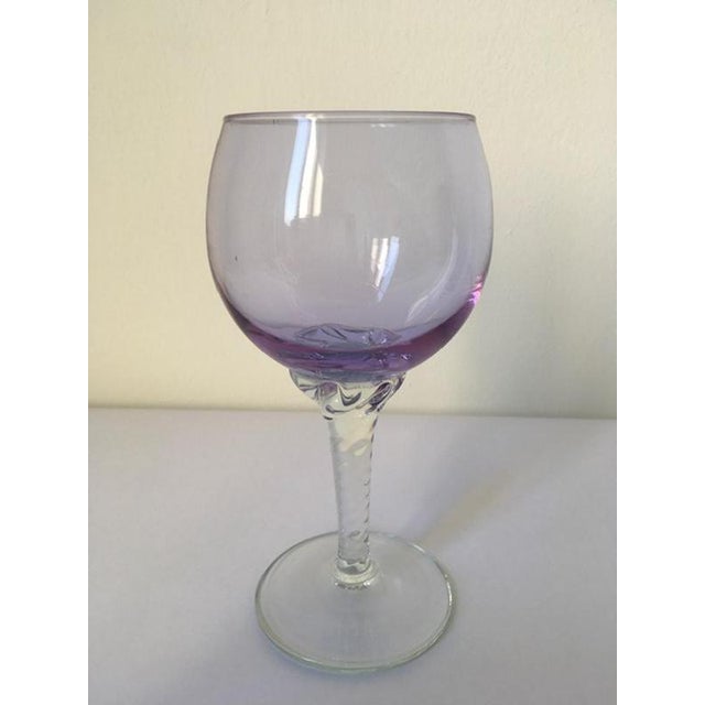 This is an elegant goblet hand made in Murano, Venice in 1960 in Murano blown glass. The piece is very charming and on it...