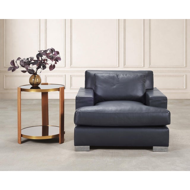 A sophisticated and modern Pryce Club Lounge Chair designed by Ralph Lauren. The grand chair features a huge hardwood...