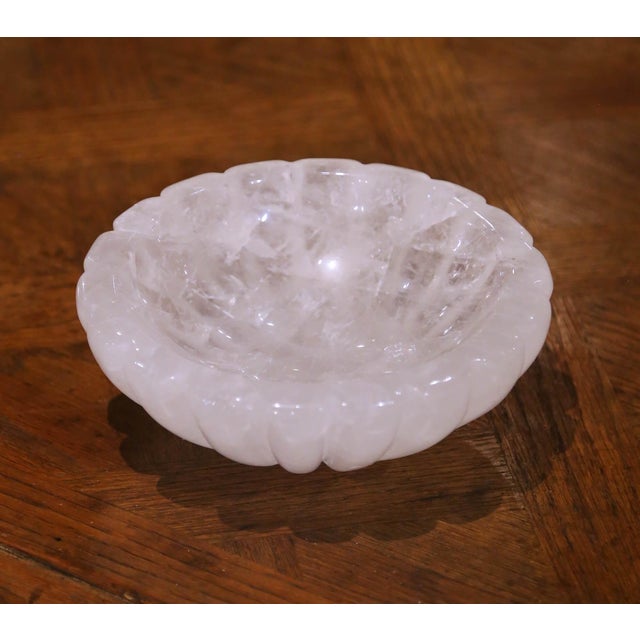 Hand carved in Brazil, this elegant rock crystal bowl features a deeply scalloped form with a beautifully polished surface...