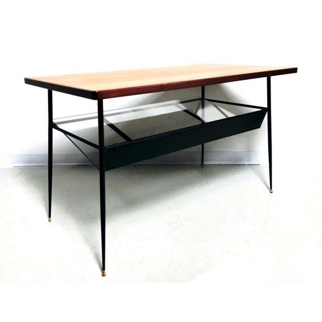1950s coffee table with magazine rack, made in Italy, metal frame with brass legs, teak wood top, and beveled glass...