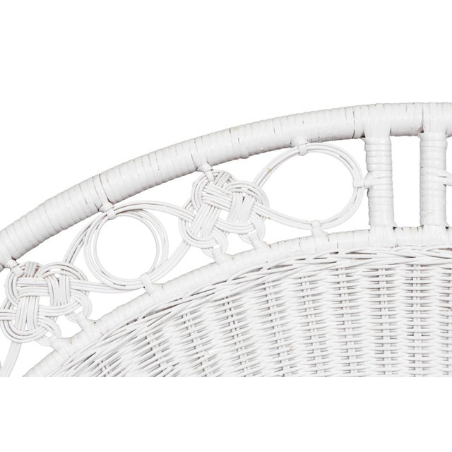 A pair of white twin size bamboo and rattan headboards. Arched frames of wicker woven rattan are decorated at the outer...