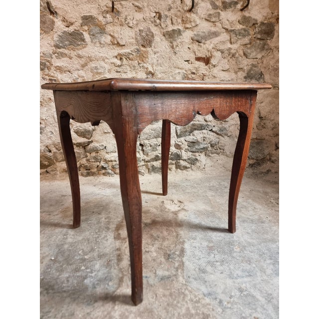 Antique oak side table dating from the 18th century, crafted in a provincial Louis XV style. Made from solid oak, this...