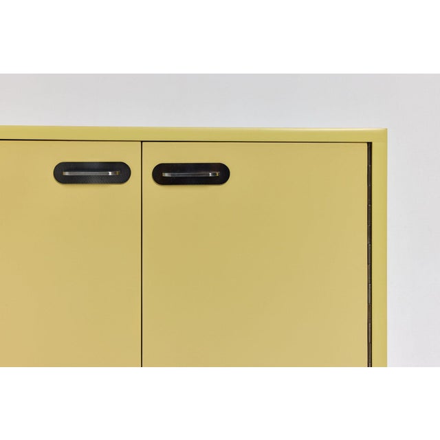 A unique vintage sideboard made in Germany in the 1960s, featuring a simple, minimalist form and elegant proportions. It...