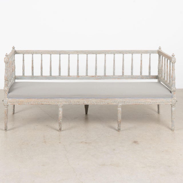 19th century Swedish Gustavian bench, crafted in pine with a wonderfully distressed original painted finish. Layers of...