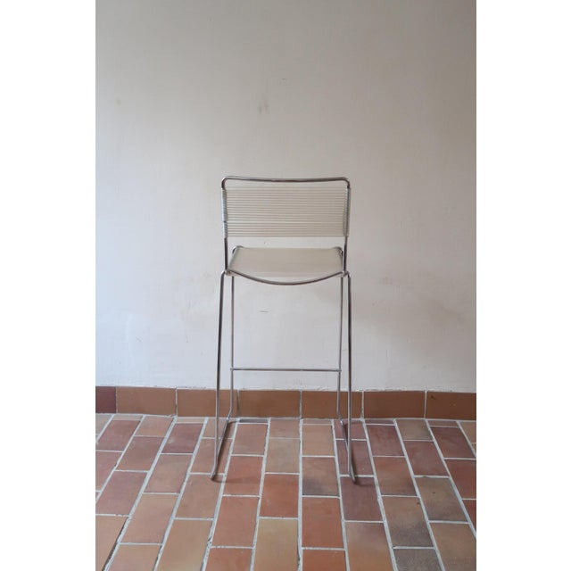 Spaghetti bar stool designed by Giandomenico Belotti and produced by Alias in Italy. The frame is a single run of chromed...