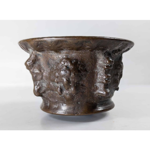 We are selling this heavy early bronze mortar. This mortar is probably French and is roughly sand cast with masks and...