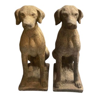 Pair of Vintage Weathered Cast Stone Seated Pointer Garden Statues For Sale