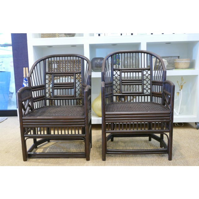 Two near pair bamboo cane chairs that have been carefully restored and re-stained, in good Vintage condition. However,...