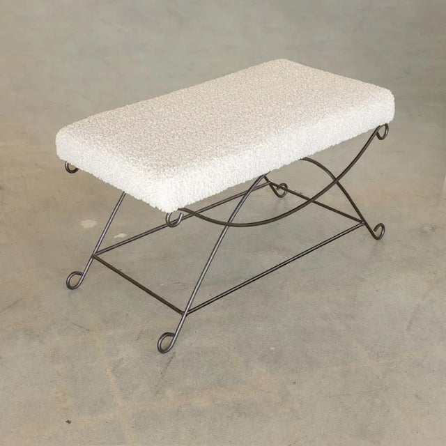 Beautiful iron bench with curved and looped base painted in a matte black finish inspired by French design. Rectangular...