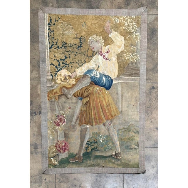 This exceptional 17th century Brussels tapestry panel depicts a lively courtly figure rendered in the refined weaving...