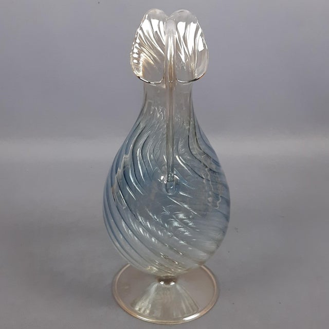 A refined blown glass jug made by the Italian glassmaker Parise (Parise Vetro) in the 1980s. An object that combines...