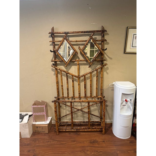 Early 20th century English vintage bamboo hall stand. All original with beveled diamond shape mirror panels. 6 hooks for...