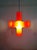 Orange polyethylene "crosslight" pendant light designed in 2001 by dutch designers jan melis and ben oostrum for the...