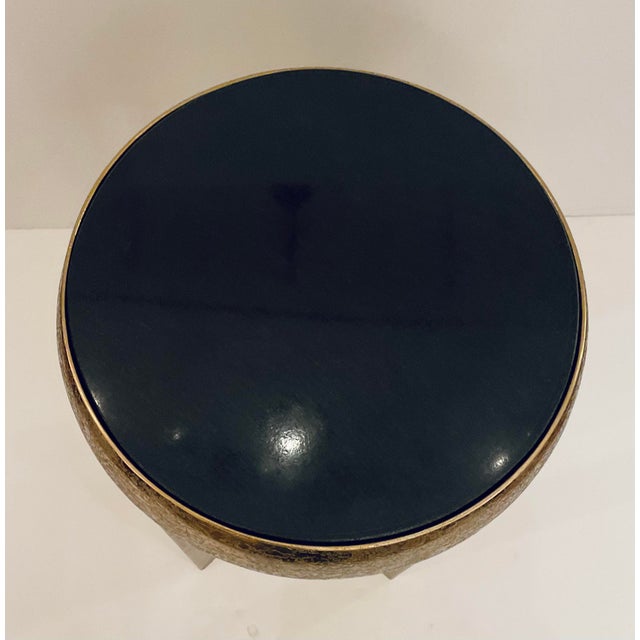 Original retail $1425, stylish John Richard Textured Gold Annula Side Table, black marble top, showroom floor sample