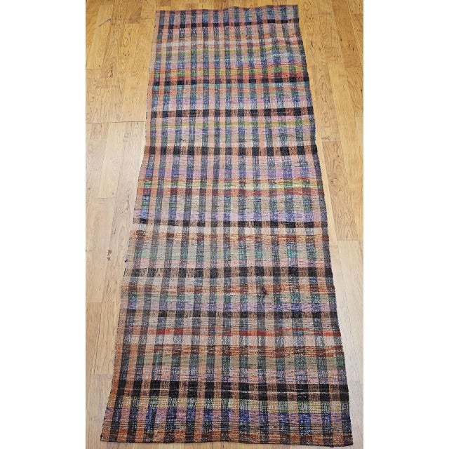 A charming piece of American handcrafted folk art, this magnificent vintage American rag runner is a beautiful example of...