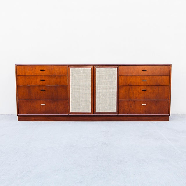 A newly refinished mid century modern oak credenza / sideboard with rattan paneling by Jack Cartwright, made by Founders...