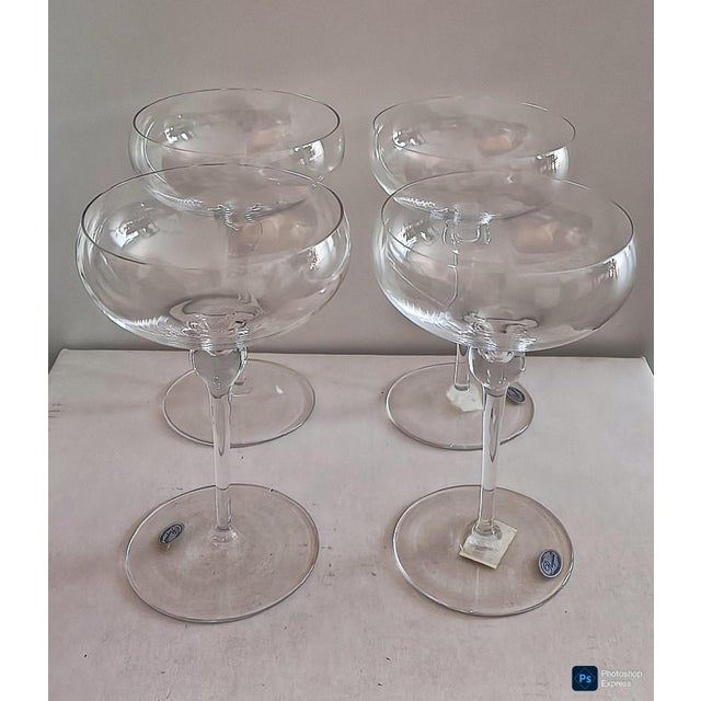 8 crystal champagne coupes or margherita glasses. made in slovenia. label says Rogaska. they were blown, not molded....