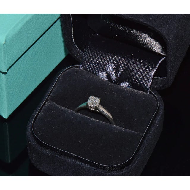 Genuine Tiffany & Co. Lucida 950 solid platinum 0.51CTS diamond ring. This ring features a classic solitaire design with a...