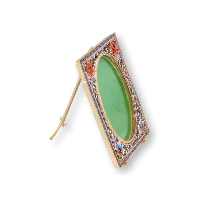 An exceptional Italian micromosaic picture frame featuring vivid floral glass tesserae set against a rich cobalt and gold...