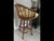 Classic McGuire Barstools. Rattan and Rawhide with tan leather seats Swivel. Brass foot ring. In excellent condition.