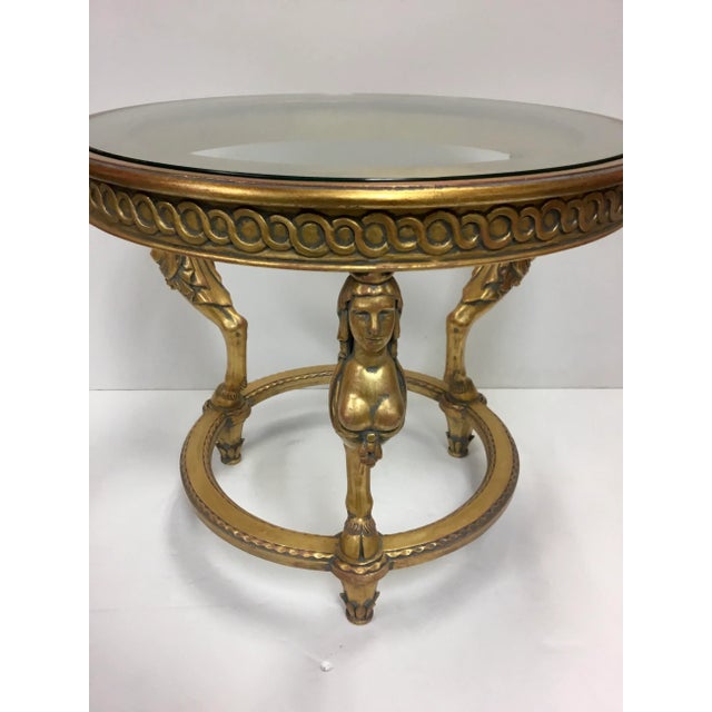 Original retail $2528, elegant empire style gold leaf and glass end table, three caryatids, showroom floor sample, made in...