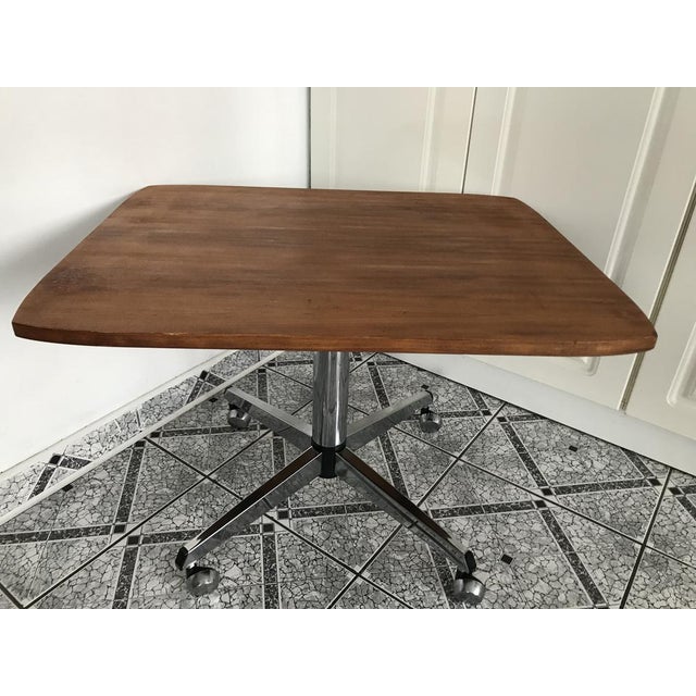 A coffee table with a chrome leg and wheels from the 1970s In good condition. All old varnish coatings cleaned down to the...