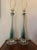 Stunning, authentic pair of Mid-Century Modern Italian Murano glass table lamps. Masterfully crafted using the traditional...