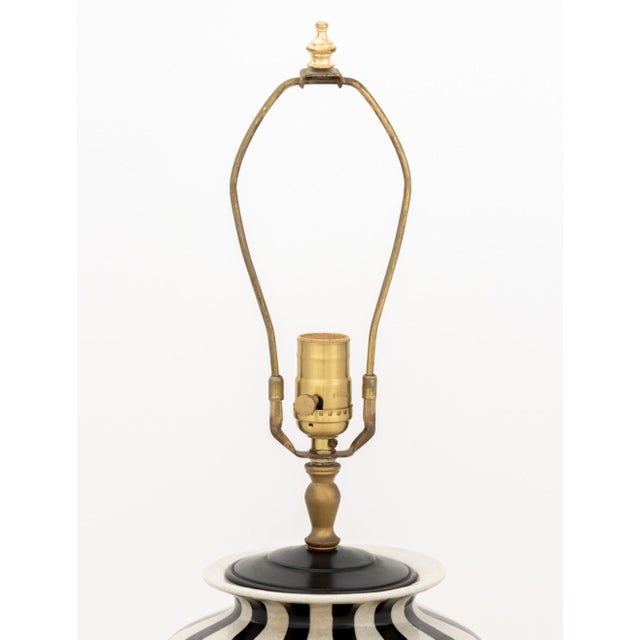 Modern Black and White Striped Crackle Glazed Porcelain Urn Mounted as Lamp, on ebonized circular base. 29.25" H x 8"...