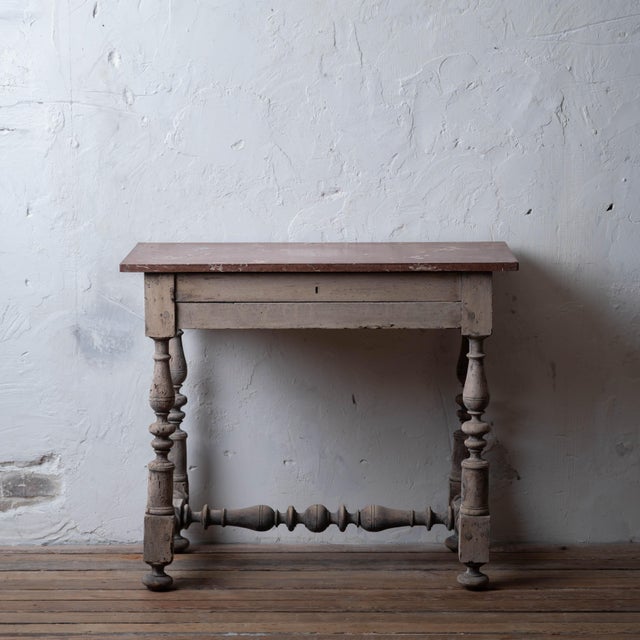 Continental Baroque bleached chestnut work table, circa 1720. Rectangular red marble top above drawer—both added late 19th...