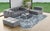 A hand-knotted wool rug, made in India and measuring 6' x 9'. Floral drawing carried across the field inside a traditional...
