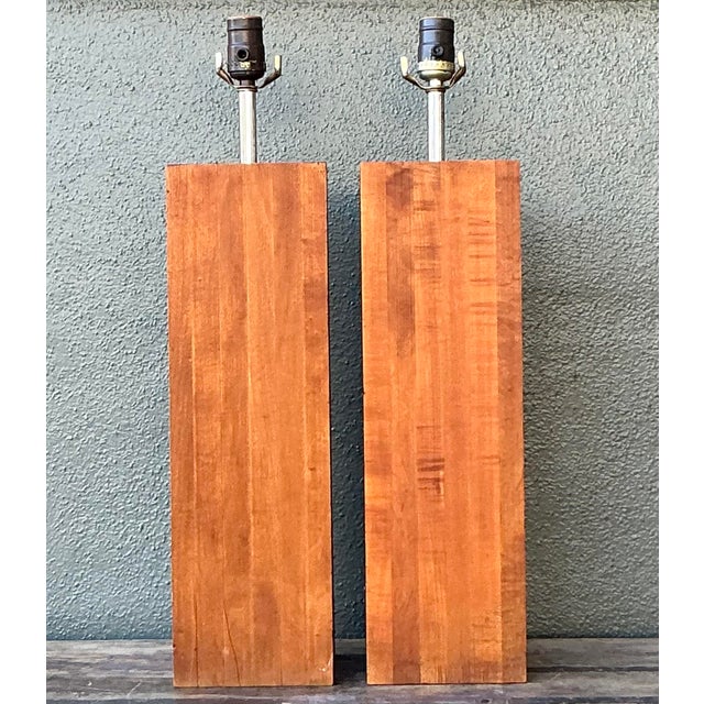 Ground your lighting design with this architectural pair of vintage wood column lamps. Dating to the 1970s, these lamps...