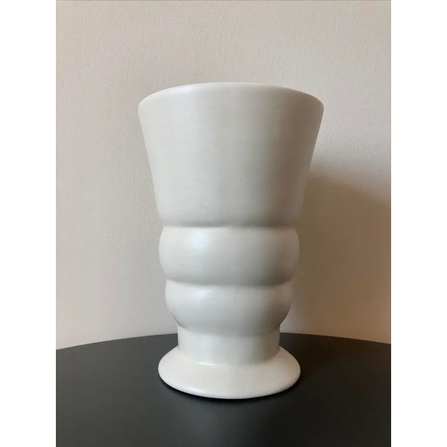 A beautiful white glazed porcelain ceramic pottery vase by Haeger, USA, circa 1930s. Vase has a banded body with...