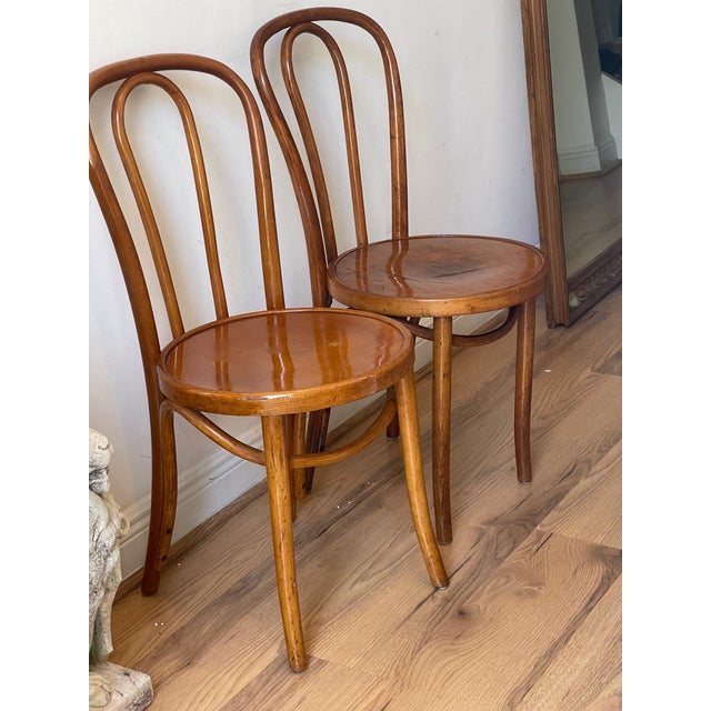 Pair of Art Deco side chairs in bentwood Thonet style. Age related signs of use.