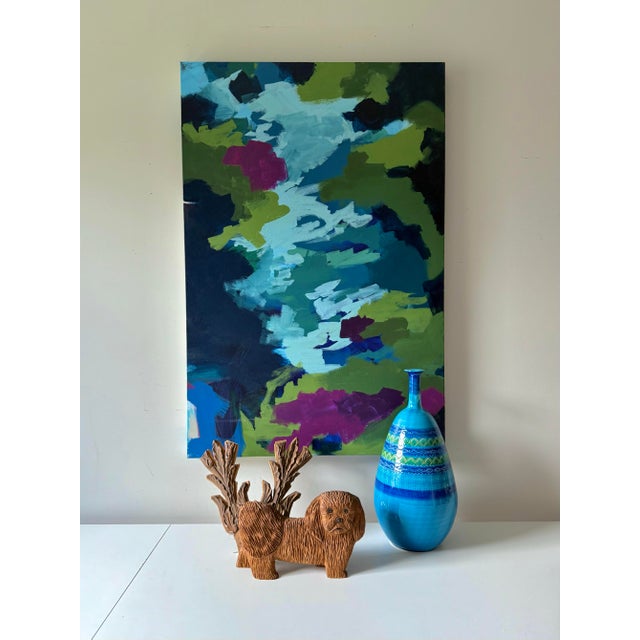 Bright, fun, and colorful blue, purple, and green toned abstract acrylic painting on stretched canvas. The layers of this...