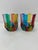 This lovely pair of lowball whiskey glasses features incredible colors and would be a wonderful addition to any room....