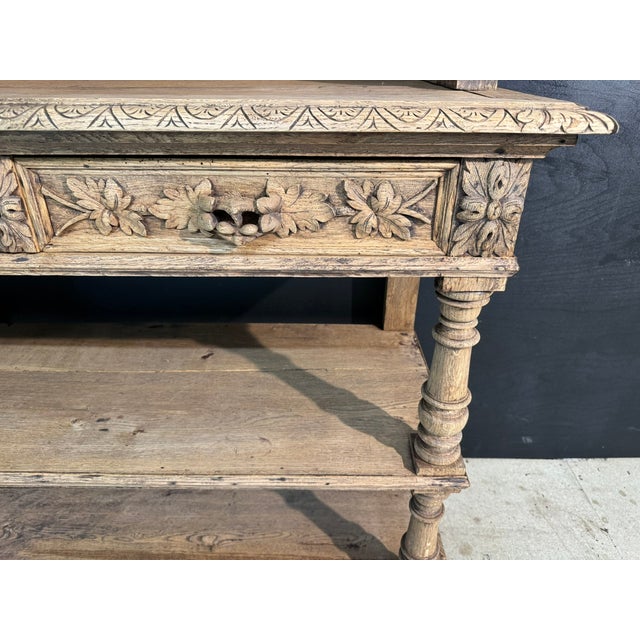 A delightful French Carved Oak Buffet or Server dating to around 1860. Intricate carvings adorn the whole piece and 2...