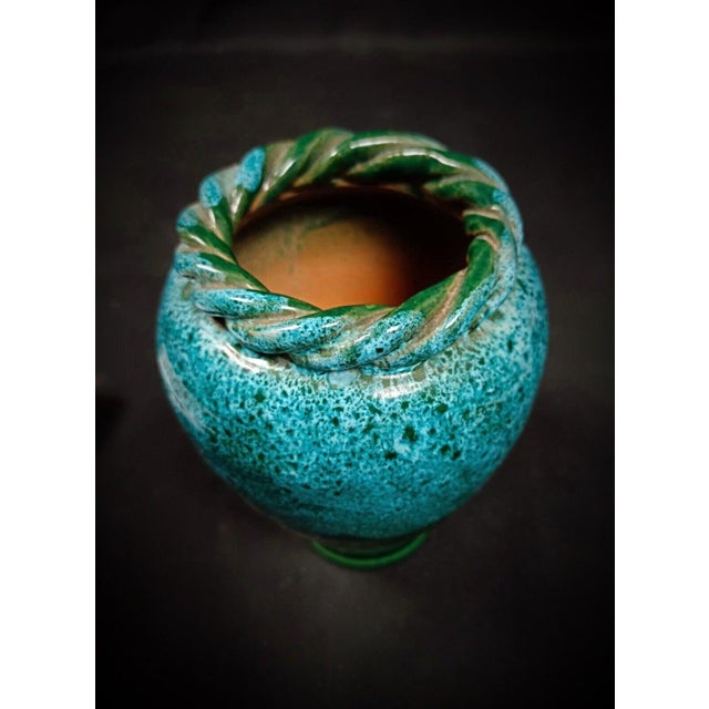 This charming vintage enameled vase is a delightful decorative piece, perfect for adding a touch of elegance to any space....