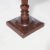 An antique Neoclassical sculpture pedestal offers mahogany construction with square display raised on turned, tapered and...