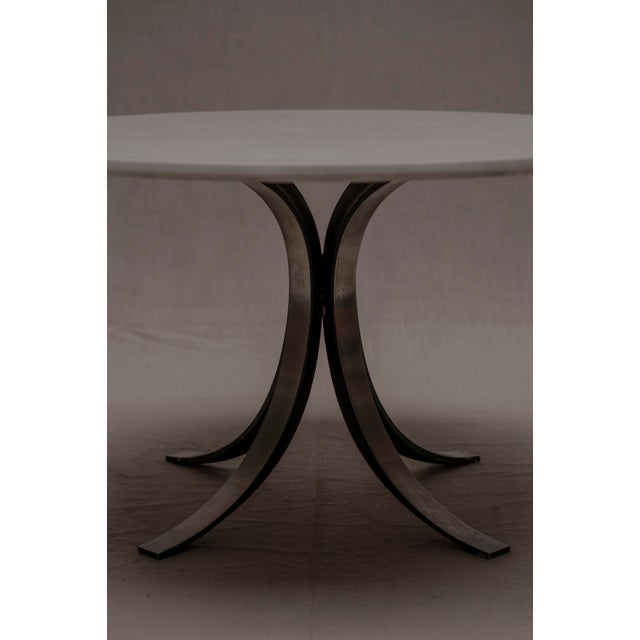 Large vintage Italian round dining table model T69. Designed by Osvaldo Borsani and manufactured around the 1960’s by...