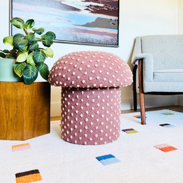 A handmade mushroom shaped ottoman, upholstered in a dotted wool blend "Petal Pink" fabric. Perfect for using as a...