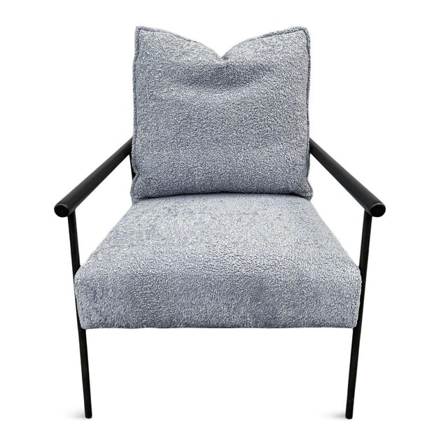 Light grey-blue sherpa upholstered accent chair with black iron frame. Includes matching back pillow. Cozy stylish modern...